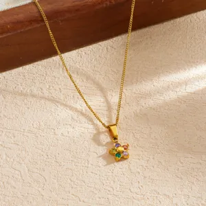 Detailed view of a gold-plated flower pendant necklace with vibrant multi-colored rhinestones