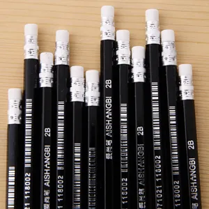 Close-up macro view of black 2B hexagonal drawing pencils with integrated erasers