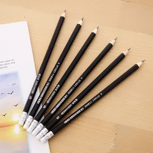 Detailed view of six black hexagonal 2B pencils with erasers on wood surface