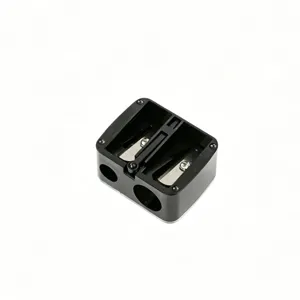 Close-up of black double-hole manual pencil sharpener for eyebrow and lip liners.