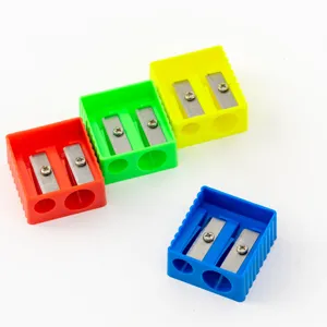 Detailed shot of colorful plastic dual-hole pencil sharpeners, compact and practical stationery.