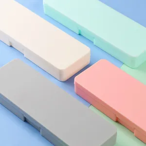 Minimalist macaron color PP plastic pencil cases for students in a clean flat lay view