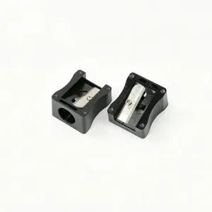 Macro view of two black 12mm aperture makeup pencil sharpeners for eyebrow pencils