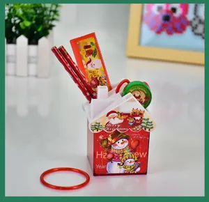 Detailed view of the 6-piece Christmas stationery set featuring a house-shaped pen holder