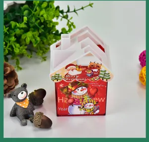 Detail of house-shaped Christmas pen holder with Santa Claus and Snowman graphics