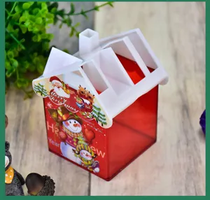 House-shaped red transparent Christmas pencil holder featuring festive snowman and Santa prints