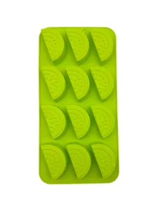 Top view of a bright green silicone mold with 12 watermelon slice shaped cavities