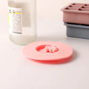 Macro view of a 10cm pink flower silicone cup lid with a decorative floral handle