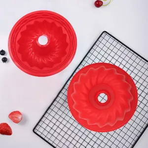 Detailed view showing the spiral texture of a red silicone Bundt cake baking mold
