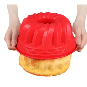 Red spiral silicone bundt cake mold for heat-resistant baking, food-grade circular tray