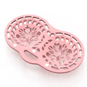 Detailed view of pink silicone bra laundry bag with floral hollow design pattern