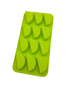Detail view of watermelon slice cavities in green silicone baking mold