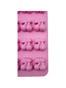 Close-up macro detail of cherry-shaped cavities in a professional pink silicone fruit cake mold