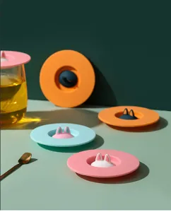 Detailed view of colorful silicone cup lids with cute cat ear handles in various colors