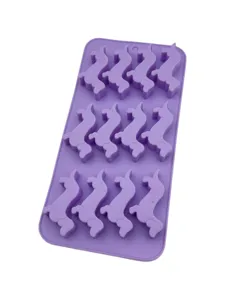 Close-up detail showing the nine cavities of a purple dachshund dog shaped silicone baking mold