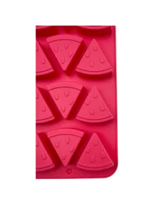 Close-up detail of red silicone mold featuring watermelon slice shaped cavities for DIY baking.