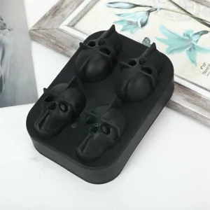 Detail of black 4-grid silicone skull ice mold for Halloween whiskey cocktails