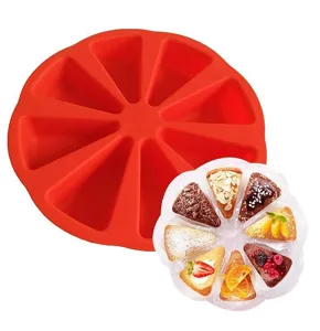 Detail view of 8-cavity red silicone triangle cake mold showing mold and finished results