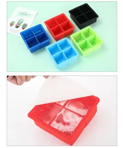 Red 4-cavity silicone ice cube mold with a translucent lid revealing large ice cubes