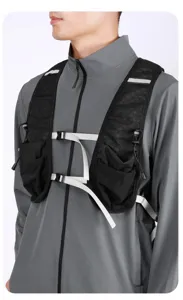 Close-up of black multi-functional running vest with adjustable straps on a model