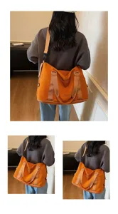 Back view of a large orange fitness travel bag worn by a model in a minimal room