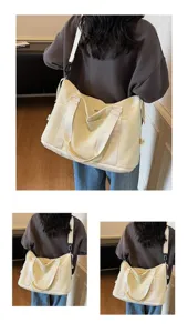 Detailed view of model wearing a large cream waterproof travel bag for sports and fitness