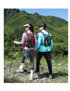 Back view of models wearing lightweight breathable hiking backpacks in mountain landscape