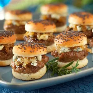 Delicious freshly made mini slider burgers on a blue tray, perfect for BBQ and party food.