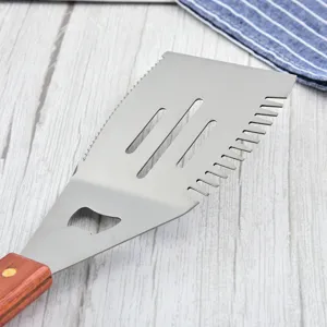 Close-up of a multifunctional stainless steel BBQ spatula with a durable wood handle