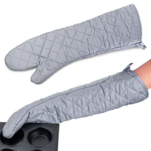 Close-up of extra-long gray quilted heat-resistant oven mitts with a baking tray