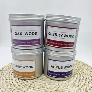 Detalle de cuatro latas de 80g de astillas de madera natural para pistola ahumadora.