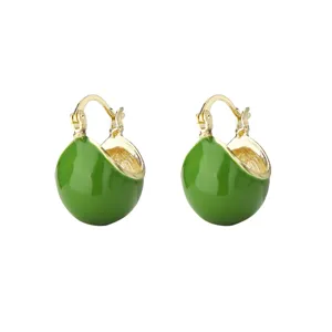 Detail macro view of vintage green enamel hoop earrings with elegant gold-tone finish.