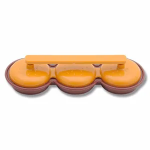 Detail shot of the 3-hole plastic mini burger press tool, convenient for making uniform patties.