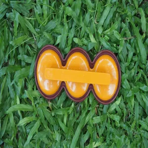 Detailed shot of triple hole plastic mini burger press tool for BBQ meat patty making.