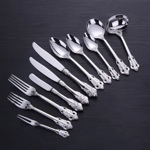 Close-up of vintage silver-plated stainless steel cutlery set with ornate handles