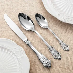 Silver vintage royal style stainless steel cutlery set with intricate carvings