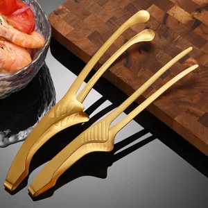 Detailed macro view of gold-toned stainless steel food tweezers for BBQ and kitchen