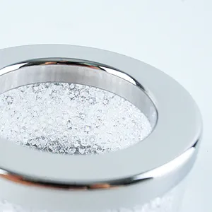 Detailed close-up of sparkling crystal rhinestone napkin ring with sleek silver alloy metal frame.