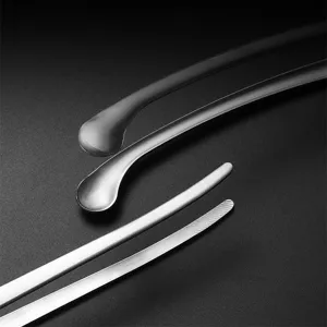 Macro view of professional stainless steel BBQ tweezers showing high-quality textured tips