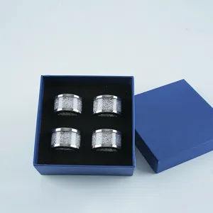 Set of 4 rhinestone napkin rings in blue gift box, elegant sparkling table decor for dining.