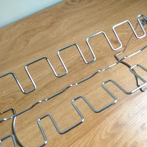 Close-up of durable stainless steel barbecue rack showing the curved wire slots