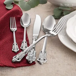 Elegant vintage silver stainless steel cutlery set featuring ornate baroque pattern handles