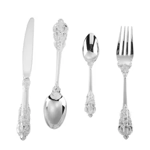 Vintage silver-plated royal style 4-piece cutlery set with ornate carving details