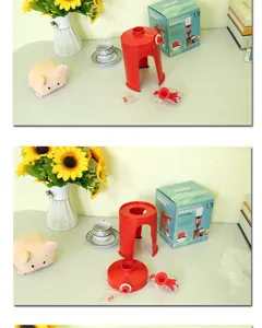 Detail of red portable beverage inverted drinker with components and packaging box