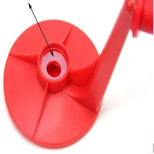 Macro detail shot showing the inner white silicone seal ring on a red soda dispenser handle