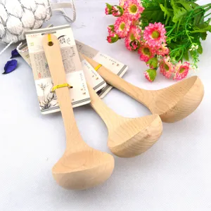 Close-up detail of eco-friendly wooden soup ladles with curved handles and natural grain