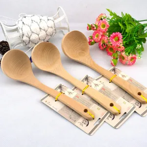 Detail of long-handle wooden soup ladles with eco-friendly natural wood grain