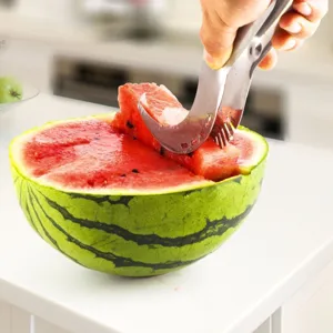 Action shot of a stainless steel watermelon slicer cutting a fresh slice of watermelon.