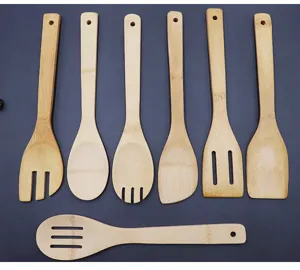 Detail of 7-piece natural bamboo kitchen utensil set featuring various spatulas and spoons.