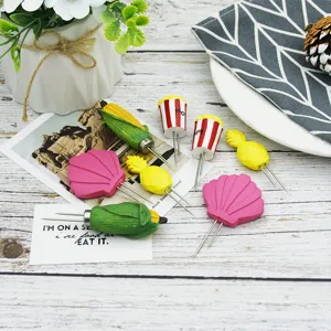 Detailed shot of creative cartoon corn holders and fruit picks set for BBQ dining